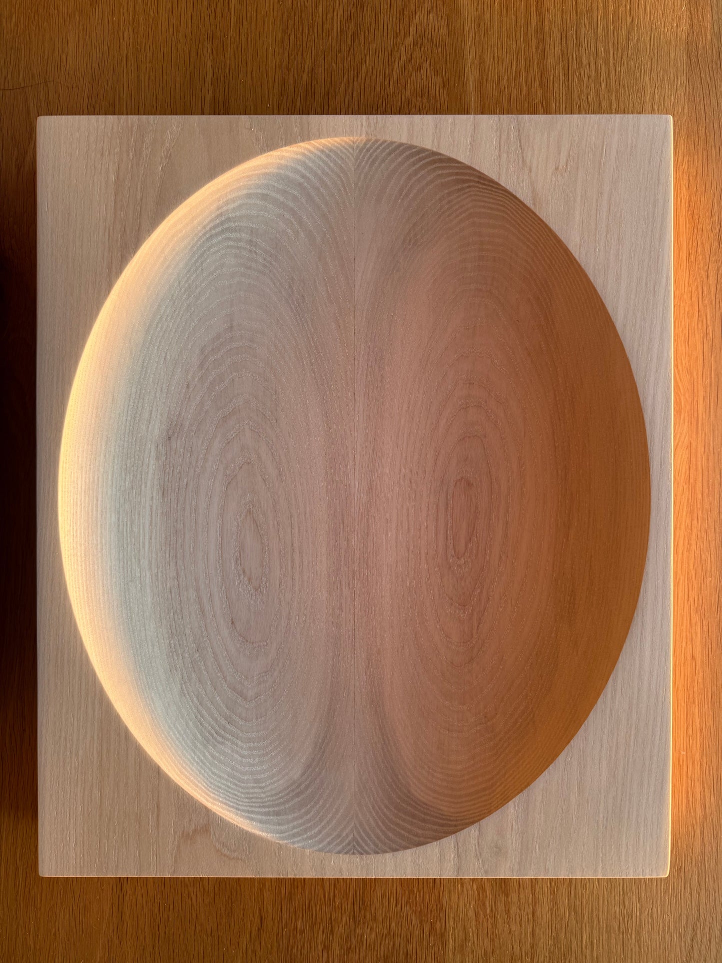 Display bowlsmooth oval shape cut into solid hardwood